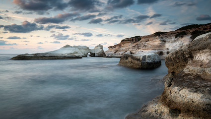 Rocky seashore seascape with wavy ocean at sea caves coastal area  in Paphos, Cyprus