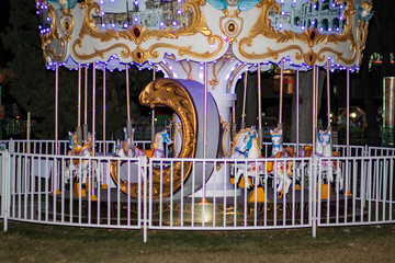 Scenery in the form of a luminous carousel in the park