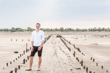 man and the dead sea.On the dry ground,Concept drought and shortage of water crisis