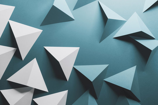 Abstract pattern made of colored paper, blue background