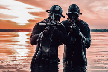 Team of fighters of a special unit move on water to complete the task. The concept of instability,...