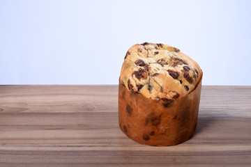 panettone christmas bread with christmas arrangements on the wooden table on white background
