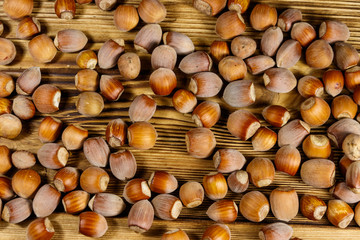 Heap of hazelnuts on a wooden table