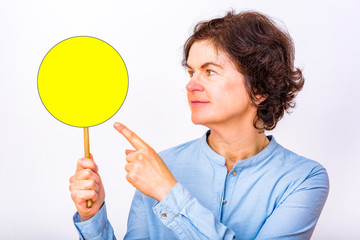 Woman holds up signboard