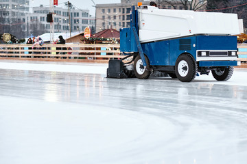 Ice resurfacing machine ,Ice resurfacer, resurfacing the ice rink in the central park of the town.