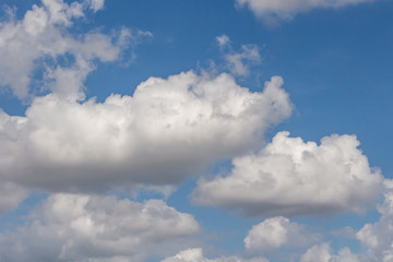 Beautiful horizontal texture of a blue sky with bright white clouds