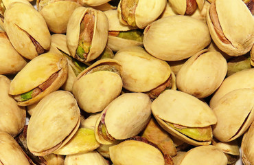 many roasted pistachios in close up