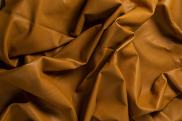 Texture cuir jaune moutarde plissée