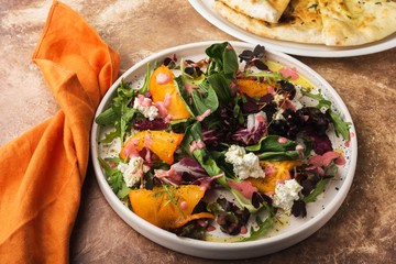 Beautiful salad with persimmon and ricotta