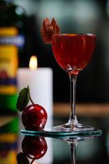 glass of red wine on wooden table