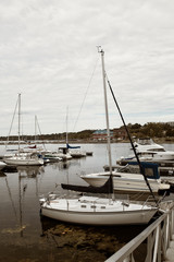 Fototapeta na wymiar Boats docked along a harbor at Lake Champlain in Burlington, Vermont