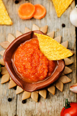 blended red salsa on the wood background