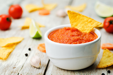 blended red salsa on the wood background