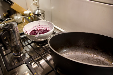 A very dirty kitchen after cooking a meal for a celebrity, with used dishes, ready for tidy up