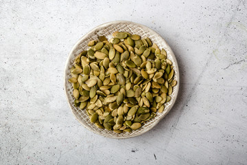 Pumpkin seeds in a ceramic plate