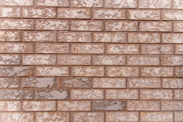 Wide shot of textured brick wall