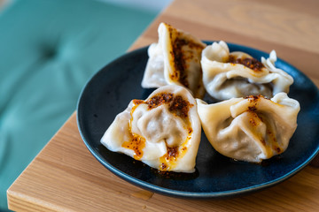 Homemade Steamed Asian Dumplings with Garlic Sauce.