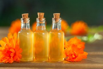 Essence of lavender flowers on table in beautiful glass bottle