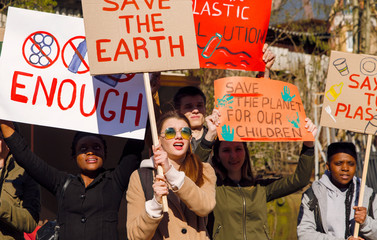 People protesting on street with posters