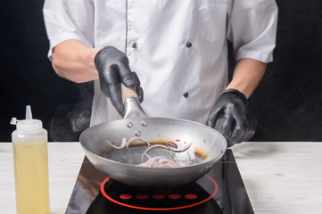 Chef cooks ramen in stages