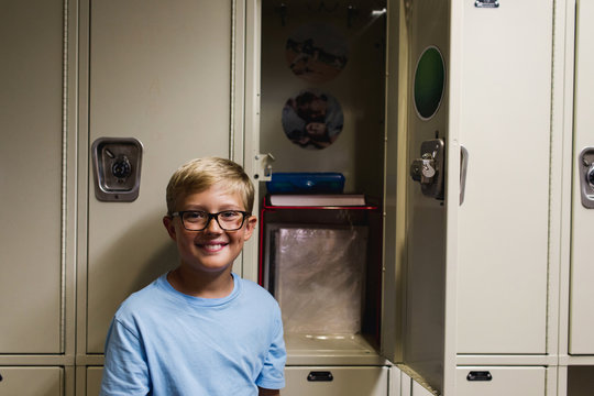 middle school student proud of his first locker