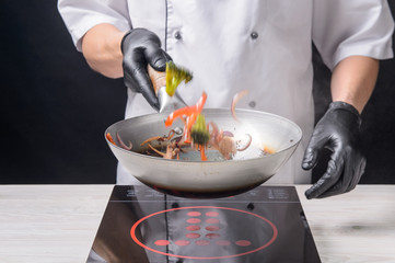 Chef cooks ramen in stages