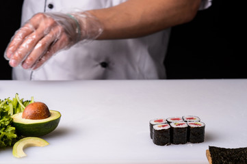 Chef cooks maki in stages