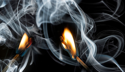 a match with fire and smoke