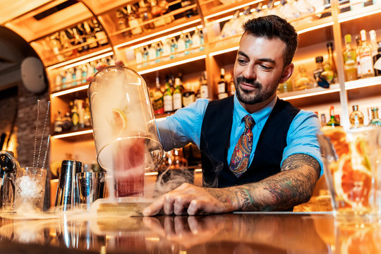 Professional young bartender working