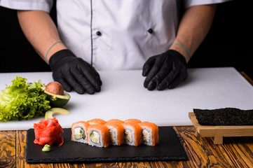 Chef cooks maki in stages © Михаил Шорохов