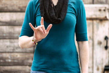 ASL: Woman Signs ""I love You""