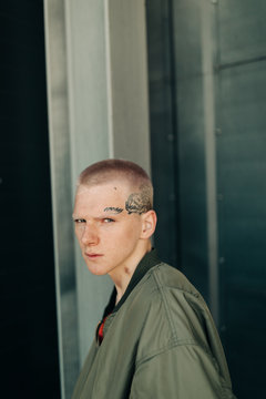 Portrait of young man with tattoo on his face