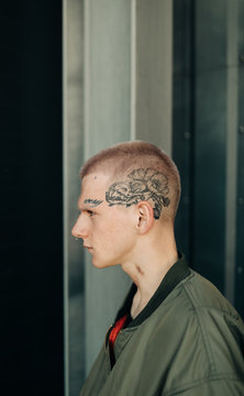 Portrait Of Young Man With Tattoo On His Face