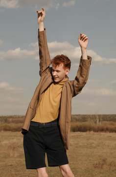 Young guy having fun in field