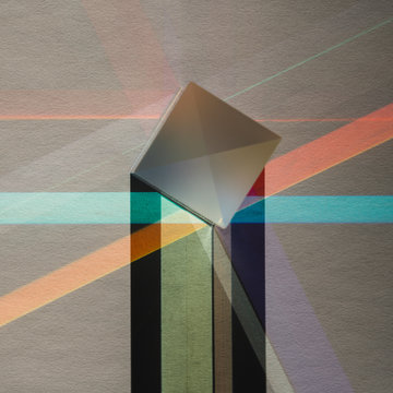 Prism glas cube with refraction of light on paper