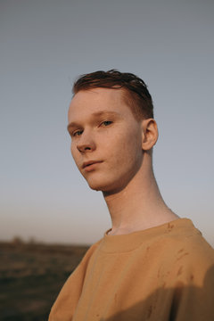 Young male looking at camera in nature
