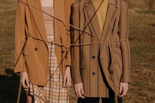 Crop models tied up with rope in field