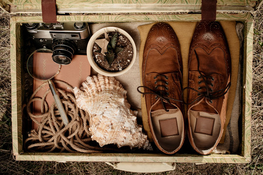 Retro suitcase with travel supplies