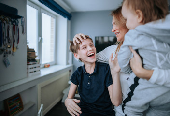 Young happy mom and her sons