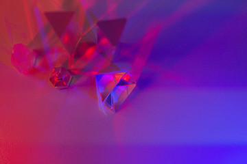 Glass prisms and quartz in pink, blue, purple coloured light