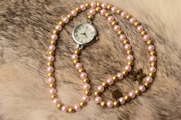 Wrist watch with white beads and rice