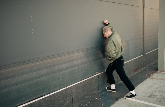 young man against wall