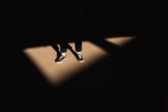 Young Man inside light triangle