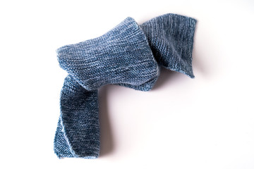 Knitted Wool textured Clothes toned in trendy classic blue color isolated on white background.