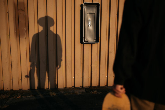 Silhouette of person wearing cowboy hat