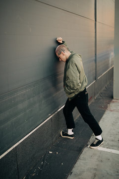 young man against wall