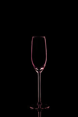 Champagne glass on the dark background.. Fine cristal glassware concept. Vertical