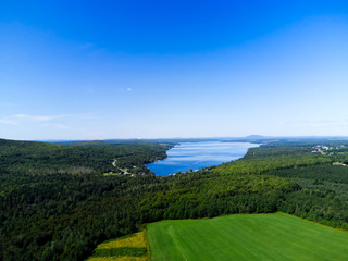 Fototapeta na wymiar Aerial landscape with lake and blue sky