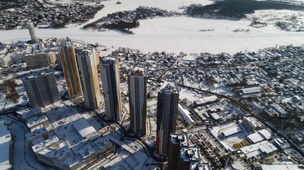 Pavshinskaya poyma district of Krasnogorsk, Moscow region, Russia. Mitino District is administrative district  of Moscow. Commuter town with very dense houses. View above. Winter snow day