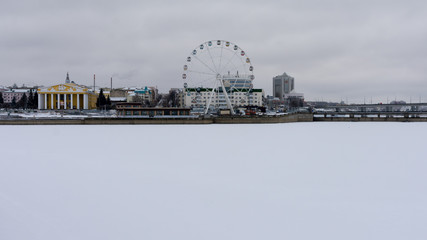 Cheboksary. Ferris wheel and the building of the drama theater on the shore of the Cheboksary Bay